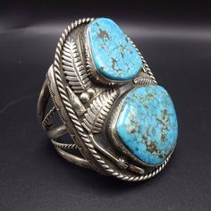 "VINTAGE NAVAJO BRACELET DESCRIPTION: This impressive cuff features two gorgeous specimens of blue Ithaca Peak turquoise The gemstones are secure in smooth bezel, on a foundation of heavy gauge vintage sterling silver. Twisted silver frames the cuff, while applied leaves and raindrops embellish the tableau. This spectacular bracelet will be a cherished addition to your collection of fine vintage Native American jewelry. MEASUREMENTS: Interior of the cuff measures 5 1/4\" with an additional 1 1/2 Navajo Bracelet, Vintage Native American Jewelry, Turquoise Jewelry Native American, Silver Frames, Turquoise Bracelet Cuff, Vintage Navajo, Turquoise Cuff, Southwestern Jewelry, Native American Jewelry