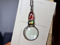 "Follow our INSTAGRAM for updates: @bustani.jewelry  Magnification of glass 10 x magnification© ♠ Handmade with passion ♠ © Glass artistic loupe necklace  with natural  stone . Decorated in retro aesthetics, reminiscent of antique manner. Artistic Unique Long necklace. RUSTIC Boho Necklace * © One of its kind © * ♥ I sell the necklace exactly at the pictures. Created in my home studio. Tifanny method - eco friendly tin, highest quality ** ♂ ☼ Beautiful and unique stones framed with artistic whim Spiritual Glass Jewelry With Round Pendant, Shape Magnifying Glasses, Unique Glass Jewelry With Lobster Clasp, Spiritual Glass Pendant Jewelry, Magnifying Glass Necklace, Seashell Jewelry, Labradorite Jewelry, Rustic Boho, Magnifying Glass