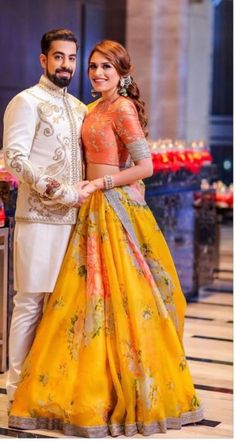 Gorgeous yellow and orange lehenga for mehendi. See more on wedmegood.com  #wedmegood #indianbride #indianwedding #groom #lehenga #lehengacholi #mehendi #mehendioutfits #couplegoals Haldi Outfit, Mehendi Outfits, Lehnga Dress, Couple Dress, Half Saree Designs, Indian Bride And Groom, Indian Bridal Dress, Indian Gowns, Indian Bridal Outfits