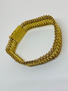 "This is a beautiful, vintage 14K yellow gold bracelet. Material(s) 14K yellow gold Measurements: This bracelet measures 7 inches in length and 14.3 millimeters in width. Weight: 24.6 grams Markings: \"14K\" If you have any questions about this bracelet, please do not hesitate to contact us! ♥" Antique Gold Bracelet Stamped 14k, Antique 14k Stamped Gold Bracelet, Rectangular Gold Bracelet With 17 Jewels, Heirloom Yellow Gold Chain Bracelet, Heirloom Gold Jubilee Bracelet, Vintage Yellow Gold Bangle Bracelet, Antique Gold Jewelry With Jubilee Bracelet, Heirloom Yellow Gold Bracelets, Heirloom 14k Gold Bracelet