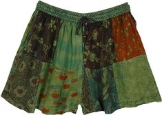 Style goes hand-in-hand with comfort with these multi-pattern handmade rayon shorts! With an elastic drawstring waist, you can adjust the size according to your comfort; The material is soft stonewashed cambric. The comfy lounge shorts have a complimenting patchwork pattern on top and two pockets for storing essentials. #tlb #Patchwork #Stonewash #Pocket #vacationclothing #Fall #bohemianfashion #bohoshorts #TeenagerShorts Green Bohemian Shorts For Summer, Bohemian Green Shorts For Vacation, Green Hippie Festival Shorts, Hippie Green Festival Shorts, Bohemian Green Short Bottoms, Green Bohemian Cotton Shorts, Summer Green Shorts With Patchwork, Green Patchwork Bottoms For Vacation, Green Cotton Festival Shorts