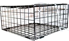 two metal cages are stacked on top of each other with white sheets in the background