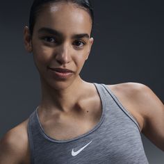 You're on the move. Your padding shouldn't be. This Swoosh bra's sewn-in pads stay in place so you can work hard without worrying about them shifting or folding. Great for training workouts and dance classes, medium support gives you a snug hold that helps keep everything in place. Plus, sweat-wicking, adaptive material quickly recovers its shape so you can stay comfortable throughout your workout. Gray Sweat-resistant Sports Bra For Workout, Compressive Sweat-resistant Sports Bra For Training, Gray Activewear With Built-in Bra For Training, Compressive Sporty Gray Sports Bra, Compressive Gray Sports Bra, Bra Sewing, Nike Sports Bra, Training Clothes, Padded Sports Bra