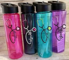 three different colored water bottles with stethoscopes on them