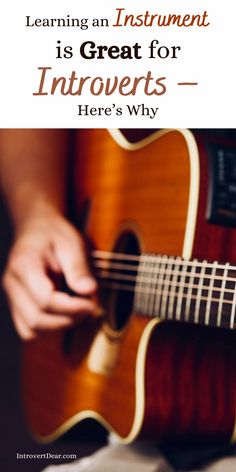 someone playing an acoustic guitar with the words learning an instrument is great for introverts here's why