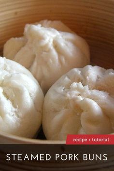 three steamed dumplings in a bamboo basket on a counter top, ready to be eaten