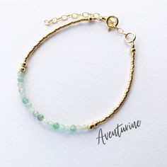 This beautiful aventurine gemstone bracelet is handcrafted with 3mm natural green aventurine beads. The gold beading is done with high quality Japanese Miyuki Duracoat delica seed beads. The larger round gold beads are 14k gold filled for lasting quality. A 14k gold filled spring clasp completes the look. It's the perfect bracelet for layering or wearing all on its own! It's simple, yet elegant design makes it a great option for every day wear. This bracelet can be purchased in either 14k gold f Gold Aventurine Beaded Jewelry, Gold Jade Crystal Bracelet With Natural Stones, Gold Beaded Amazonite Bracelets, Gold Bracelets With Natural Stones For May Birthstone, Gold Beaded Bracelets With Jade Natural Stones, Gold Jade Beaded Bracelets With Natural Stones, Gold Amazonite Bracelet, Gold Amazonite Bracelet Jewelry, Amazonite Bracelet Jewelry In Gold