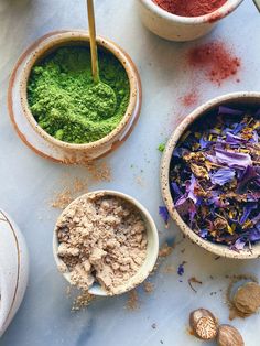 bowls filled with different types of food on top of a table