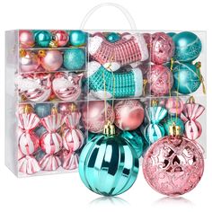 a clear box filled with assorted christmas ornament balls and baubles