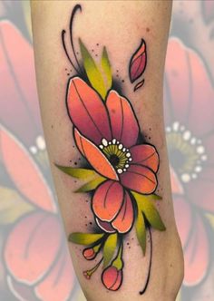 an artistic flower tattoo on the leg