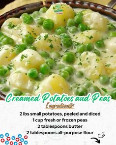 a bowl filled with potatoes and peas on top of a table