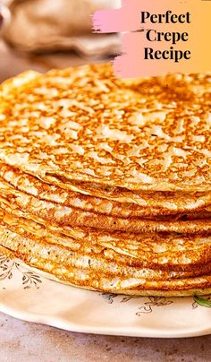 a stack of pancakes sitting on top of a white plate