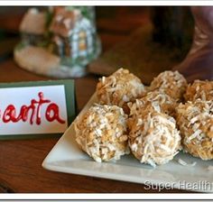 some kind of dessert on a plate with coconut flakes all over it's surface