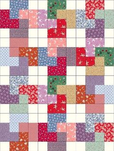 a patchwork quilt with different colors and patterns