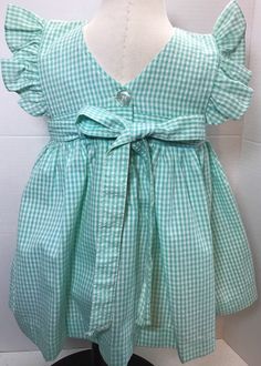 "Waist 10\"Can be tied back/ length 15\"/Shows very little wear if any at all/smoke free environment/labeled 3 to 6 months but please pay attention to measurements being true vintage/(02)" Cute Green Dress For Picnic, Cute Cotton Dresses With Tie Straps, Cute Cotton Dress With Tie Straps, Green Ruffled Dress For Picnic, Cute Ruffled Pinafore Dress For Summer, Cute Tie Back Dress For Picnic, Fitted Gingham Dress With Tie Back, Cute Cotton Dress With Bow Tie Back, Sleeveless Gingham Dress With Tie Back