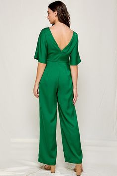 Emerald green jumpsuit with bat wing sleeves, wide legs and front tie detail with open back. Emerald Jumpsuit, Emerald Green Jumpsuit, Green V-neck Jumpsuit For Loungewear, Chic Green V-neck Jumpsuit, Green Cotton V-neck Jumpsuit, Bat Wing Sleeves, Elegant V-neck Jumpsuit With Button Closure, Wing Sleeves, Love Coupons