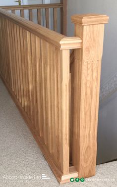 a close up of a wooden railing on the floor