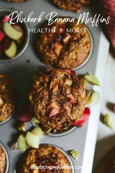 banana muffins with apples and rhubarb on top in a muffin tin