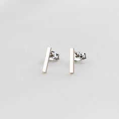 "14K White Gold Bar Earrings. 14K White Gold Simple Earrings. 14K Solid Gold Minimalist Earrings 14K solid white gold bar. It is 1.5mm wide. (Please select the length of bars : 3/8\", 1/2\" 5/8\")  The model in the picture wears 3/8\" bar earrings. 14K solid gold ear wire Please select ear nut (silicone or 14k gold)" Silver Minimalist Linear Earrings In 14k Gold, Silver Linear Earrings In 14k Gold, Minimalist Style, Minimalist 14k Gold Linear Earrings Gift, Minimalist Yellow Gold Linear Earrings In Sterling Silver, Minimalist 14k Gold Silver Earrings, Minimalist Yellow Gold Linear Earrings For Everyday, Minimalist 14k Rose Gold Linear Earrings, Minimalist Yellow Gold Linear Earrings, Minimalist Rose Gold Linear Earrings For Gift