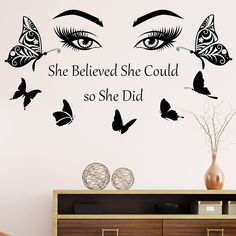 there is a wall decal with butterflies and the words she beliveed she could so she did