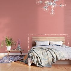 a bedroom with pink walls and a bed in the middle, surrounded by rugs