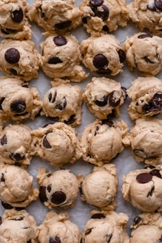 chocolate chip cookies are arranged on a baking sheet