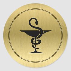 a gold medical symbol with a snake on it's side sticker is shown