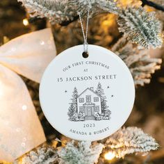 a personalized ornament hanging from a christmas tree