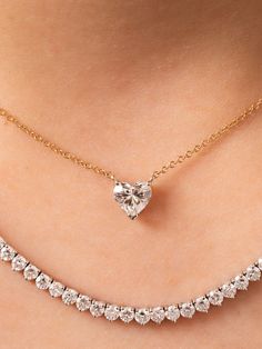 This beautiful diamond heart necklace is made to order. As always, we make a custom low profile basket for the heart diamond to sit in on a delicate 14K gold chain. It is perfect for wearing everyday on its own or layered with another necklace or two. 0.50ctw in stock is a G color SI2 clarity. Other sizes are custom made and can vary in color, clarity and cost. Available in 14K yellow, white or rose gold and the size of diamond vary based on your selection. This product is made to order and take White Diamond Necklace With Single Cut Heart Shaped Diamonds, Valentine's Day Brilliant Cut Solitaire Necklace, Anniversary Heart Cut Solitaire Necklace With Prong Setting, 14k Gold Heart Cut Diamond Accented Jewelry, Heart Cut Solitaire Necklace With Prong Setting For Anniversary, 14k Gold Jewelry With Heart Cut Diamond Accents, Heart-shaped Diamond Cut Solitaire Necklace In Cubic Zirconia, 14k Gold Heart Cut Jewelry With Diamond Accents, Heart-shaped Solitaire Necklace With Diamond Cut Cubic Zirconia