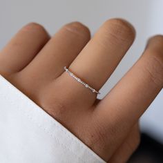 This thin, delicate and beautiful ring, featuring 7 CZ stones, is the perfect stacking ring or a minimalist ring to add to your collection! Made of 925 Sterling Silver We use a THICK, DURABLE 14k Gold or Rhodium plating - for a piece that will last you years to come! VERY HIGH QUALITY Available in sizes 4-12 Ring width: 1mm Nickel-free & Hypoallergenic We use the highest quality materials for an authentic look! Ring Sizer Rings on Model: Pave Signet Ring Rope Ring Minamalistic Rings, Silver Rings Minimalist, Elegant Silver Rings, Silver Rings Jewelry, Minimalist Rings Silver, Delicate Silver Jewelry, Ring Stacking Ideas Silver, Simple Rings Everyday, Simple Rings Silver