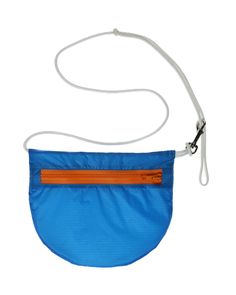 The Marlin with it's sporty electric blue and marigold orange zipper will keep you on trend well through next summer ;) THIS is a U.BAG and it might just make your life a little lighter. U.BAGs are made from ripstop nylon, cut from retired paragliders–you know–those giant kites that people attach themselves to, run off mountain sides, and float into the sky. U.BAGs are easy to wear, ultra-light and tell an amazing story of a life spent gliding through the sky. Details: One metal swivel clasp USA Electric Blue, Amazing Stories, Make It Yourself