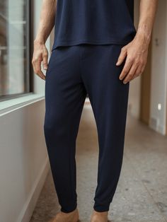 Experience a new level of comfort and style with our innovative Bamboo Waffle Knit Pant, featuring a relaxed fit with a pull-on elastic waistband and side pockets. Made from an eco-friendly blend of bamboo viscose, this pant is breathable, temperature-regulating, and odor-neutralizing, keeping you fresh and cool through hours of wear. Men's Bamboo Viscose Waffle Knit Pants in Navy (Size: Small) - Cozy Earth Lounging Sweatpants With Tapered Leg And Ribbed Waistband, Tapered Leg Sweatpants With Ribbed Waistband For Lounging, Pull-on Trousers For Loungewear, Ankle-length Pull-on Pants For Loungewear, Comfy Pants With Ribbed Cuffs For Relaxation, Comfy Bottoms With Elastic Cuffs For Lounging, Comfy Lounging Bottoms With Elastic Cuffs, Stretch Joggers With Straight Hem For Loungewear, Relaxed Fit Bottoms With Elastic Cuffs For Loungewear