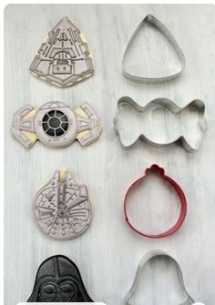 star wars cookie cutters are arranged on a table