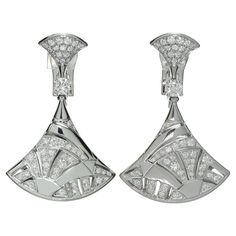 These fabulous Bvlgari earrings from the classic Diva's Dream collection features a mosaic fan design crafted in 18k white gold and set with 106 round brilliant E-F-G VVS1-VVS2 diamonds weighing an estimated 2.10 carats. Signed Bvlgari, numbered, with Italian hallmarks. Made in Italy circa 2010s. Measurements: 0.82" (21mm) width, 1.57" (40mm) length. Art Deco Silver Diamond Earrings In Platinum, Silver Art Deco Platinum Diamond Earrings, Art Deco White Gold Diamond Earrings With Brilliant Cut, Luxury Platinum Diamond Earrings For Evening, Luxury Platinum Diamond Earrings With Brilliant Cut, Art Deco White Gold Diamond Earrings, Bvlgari Earrings, Bulgari Jewelry, Bvlgari Jewelry