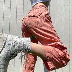 "vintage coral cargo pants by Lucky Brand pastel y2k capri cargo pants  pastel pink orange coral colored pants with front, back & side pockets that have an adjustable tie adjustable tie around the waist alone with a zipper & button closure cropped length that hits above mid calf on the 5'4 model mid waisted 100% cotton  in great condition size 4 or 27 ~ model is a size 26 & 5'4, it fits her a tiny bit loosely  measurements (remember these are mid waisted, so measure based off of where the rise h Capri Cargo Pants, Coral Pants, Cropped Cargo Pants, Colored Pants, Coral Color, Mid Calf, Lucky Brand, Pastel Pink, Cargo Pants