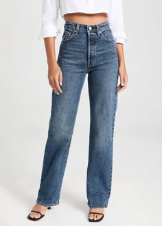 Levi's® highest high rise yet. The Ribcage Jean—with its soaring 12-inch rise—has become a hip-slimming, waist-defining, leg-lengthening obsession. This fit will show off your figure and make you feel as amazing as you look.Slim through your hip and thigh.Super high rise: 12.125".Straight leg. Button fly.99% cotton, 1% elastane.Heavyweight denim, stretch. Model is wearing a size 26. Levis Ribcage Straight, Levi's Ribcage, Ribcage Jeans, Levis Outfit, Full Length Jeans, Levis Ribcage, Valley View, Vintage Crewneck, Black Midi Skirt