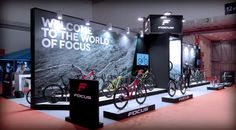 several bicycles are on display in front of a large sign that says welcome to the world of focus