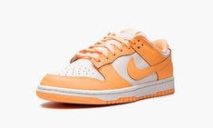 The Women’s Nike Dunk Low “Peach Cream” is a women’s-exclusive colorway of the classic shoe with a warm weather twist.  The “Peach Cream” features a cream and orange color scheme across its leather panels.  Specifically, the perforated toe, mid-panel, collar, and heel are designed in cream leather.  The overlays and Swoosh branding are constructed in peach leather.  Cream “Nike” branding is embroidered on the heel while orange “Nike” and Swoosh detailing can be found on the tongue tag.  A white Nike Dunk Low Peach Cream, Womens Dunk Low, Nike Tenis, Nike X Travis Scott, Sneakers Box, Kobe Shoes, Nike Branding, Low Air Jordan 1, Peach Cream