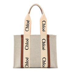 This is an authentic CHLOE Cotton Calfskin Medium Woody Ribbon Tote in White and Brown. This chic tote is crafted of brown calfskin leather and beige cotton canvas. The bag features black Chlo logos vertically on the white fabric trim that extent into the top handles with brown leather accents. The top is open to a matching fabric interior with a patch pocket. Chloe Medium Woody Tote Bag, Chloe Logo, Leather Accents, Fabric Trim, White Fabric, White Fabrics, Patch Pocket, The White, Calf Skin