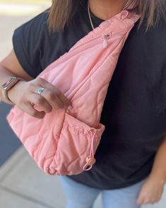 Get the best of both worlds with our Puffer Sling Bag & Backpack in Bubblegum Pink! This beautiful athleisure and trendy bag features an ogee pattern in nylon puffer material. Wear it as a sling bag across either the front or back of your body, or style it as a backpack! Includes adjustable straps, a convenient water bottle pocket, and an interior zipper pocket. Perfect for striding through the city in style! Measurements: Bag: 11"L x 4"W x 16"H / Strap: 26" - 35.5" Zipper closure Main material: Sporty Quilted Nylon Shoulder Bag, Trendy Gym Shoulder Bag With Zipper Closure, Casual Packable Backpack For On-the-go, Sporty Quilted Bag For On-the-go, Casual Shoulder Bag With Water Bottle Pocket, Trendy Gym Bag With Zipper Closure, Casual Pink Nylon Shoulder Bag, Casual Gym Bag With Zipper Pocket, Casual Quilted Nylon Bag