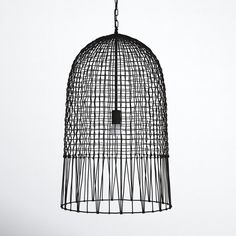 a black bird cage hanging from the ceiling