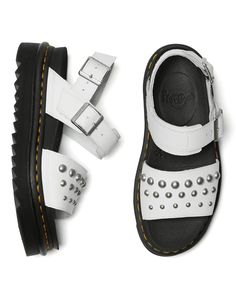 After generations of creative wearers enhancing and personalizing our footwear, customization is part of who we are. The Voss Stud sees a classic sandal amped up with DIY-inspired stud detailing. Built with two adjustable straps, the women's sandals sit on a super-lightweight sole with a ripple tread, held in place with a tough-as-nails Goodyear welt. Hydro is a smooth PU-coated leather with a matte finish. Clean by wiping with a damp cloth Adjustable strap Retains classic Docs DNA: grooved edge Casual Sandals With Rivets And Round Toe, Summer Leather Sandals With Rivets, Casual Leather Sandals With Studs, White Studded Open Toe Sandals, Tough As Nails, Thick Socks, Studded Sandals, Goodyear Welt, Women's Sandals