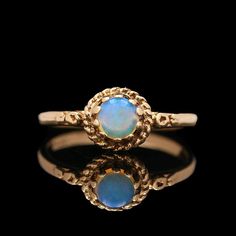 An antique 14k yellow gold and round opal cabochon ring. SR2362 Weight:1.90 grams (Inclusive of all materials) Ring Size: 6.25 Opal (1) Round Cabochon Stone Measurement: 4.55 mm Cabochon Ring, Rings Statement, Cincinnati, Statement Rings, Jewelry Rings, Opal, Ring Size, Yellow Gold, Size 6