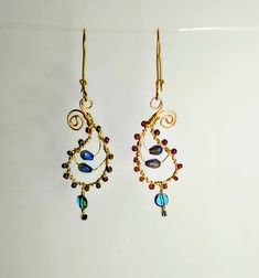 Handmade Paisley shaped beaded earrings.  Tarnish resistant gold wire and holographic glass beads. Hand shaped kidney ear wires. Elegant Gold-plated Chandelier Earrings With Ear Wire, 14k Gold-filled Wrap Earrings With Ear Wire, 14k Gold-filled Wire Wrapped Beaded Earrings, Handmade 14k Gold-filled Chandelier Drop Earrings, Handmade 14k Gold-filled Dangle Chandelier Earrings, Hand Shapes, Gold Wire, Wire Earrings, Beaded Earrings