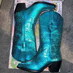 These Are A Women’s Us Size 7. The Studs Are Silver In Color And The Boot Is A Metallic Turquoise. They Are Pull On Style. Please Lmk If You Have Any Questions. Thanks For Looking. Western Style Flat Heel Party Boots, Western Style Party Boots With Flat Heel, Blue Western Party Boots, Jeffrey Campbell Shoes, Jeffrey Campbell, Shoes Heels Boots, Western Boots, Shoes Women Heels, Heeled Boots