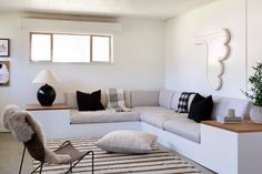 a living room filled with furniture and decor