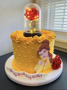 a birthday cake with a beauty and the beast theme on it