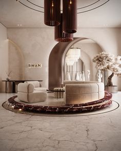 a living room with white couches and chandelier hanging from the ceiling in front of a circular mirror