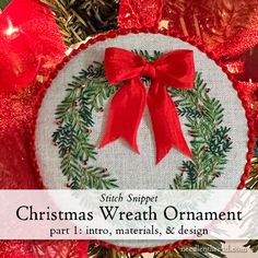 a christmas wreath ornament hanging from a tree