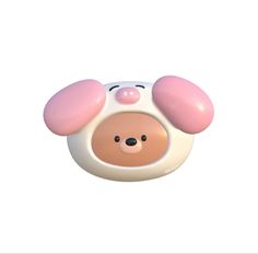 an animal shaped toy with pink ears on it's head and nose, sitting in front of a white background